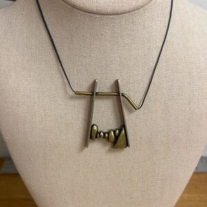 Gold tone large stone Tori pendant on string